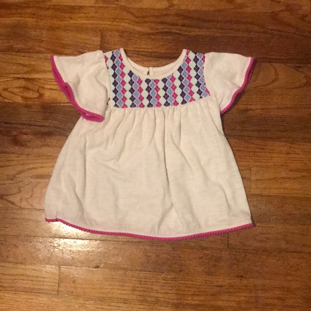 White blouse with embroidery detail